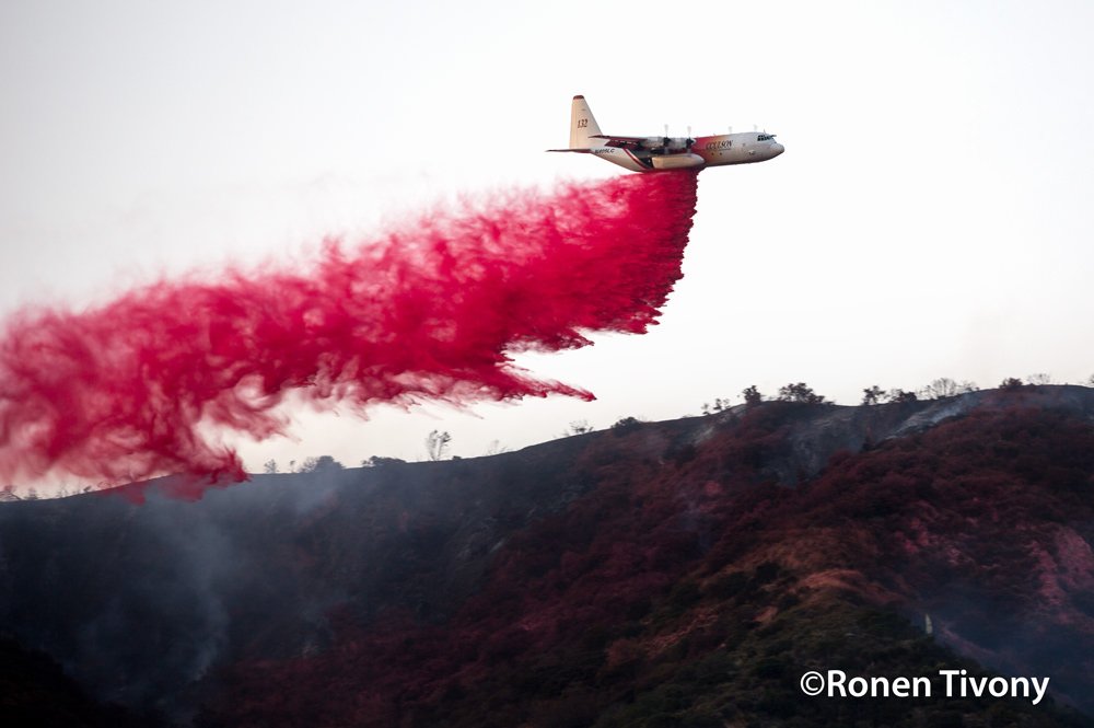 June 20, 2016 - Duarte, California, United States: A firefighting Air Tanker drops fire retardant on the Fish Fire east of Los Angeles, California. The brush fire in the Angeles National Forest, has consumed 3,500 acres and continues to rage forcing mandatory evacuations while California continues to experience triple digit temperatures. (Ronen Tivony / Polaris)